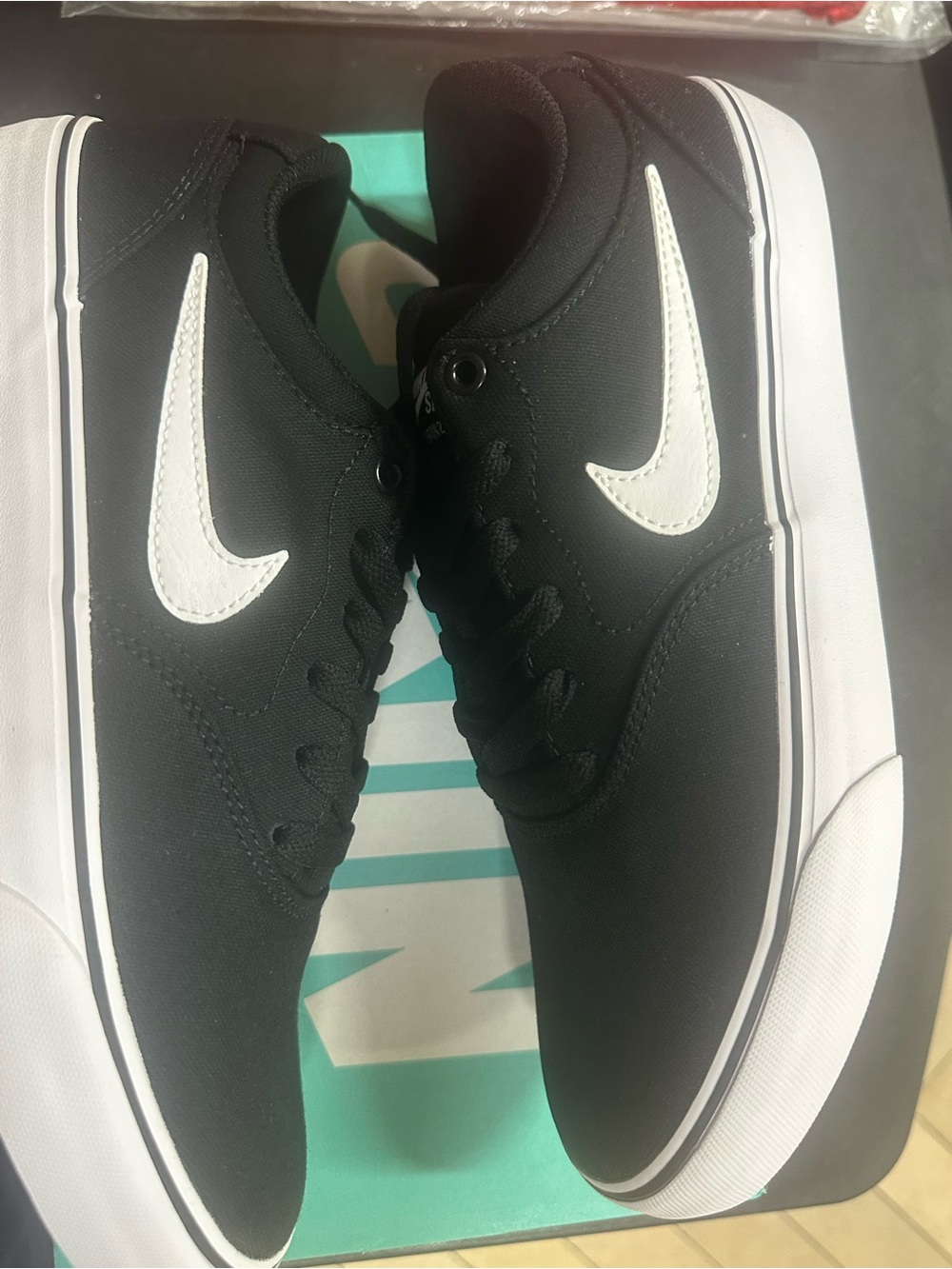 Nike Men’s Black Sneakers with White Swoosh